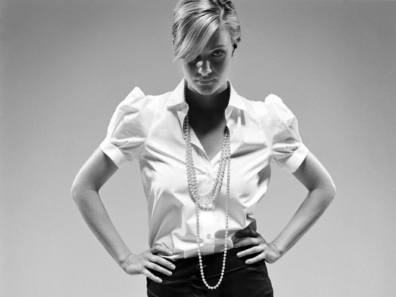 woman in white blouse with pearls
