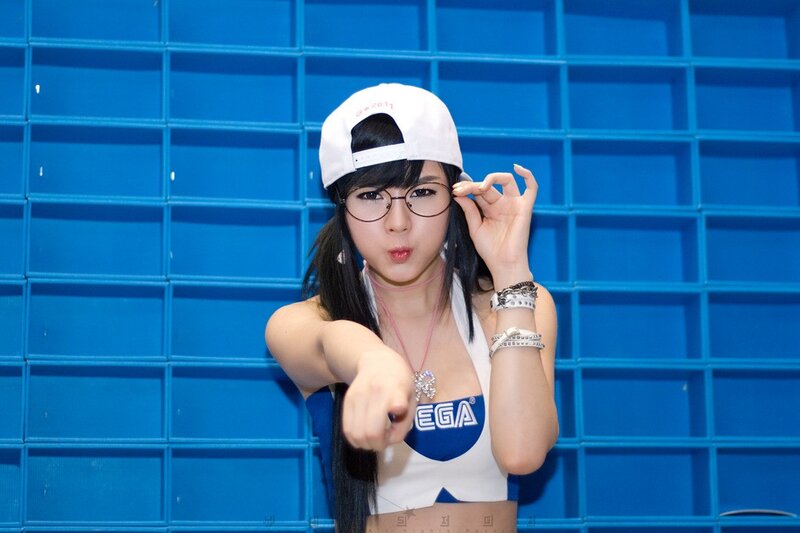 woman in white cap pointing at camera