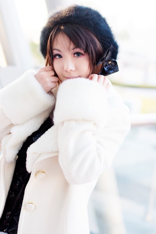 woman in white coat and hat