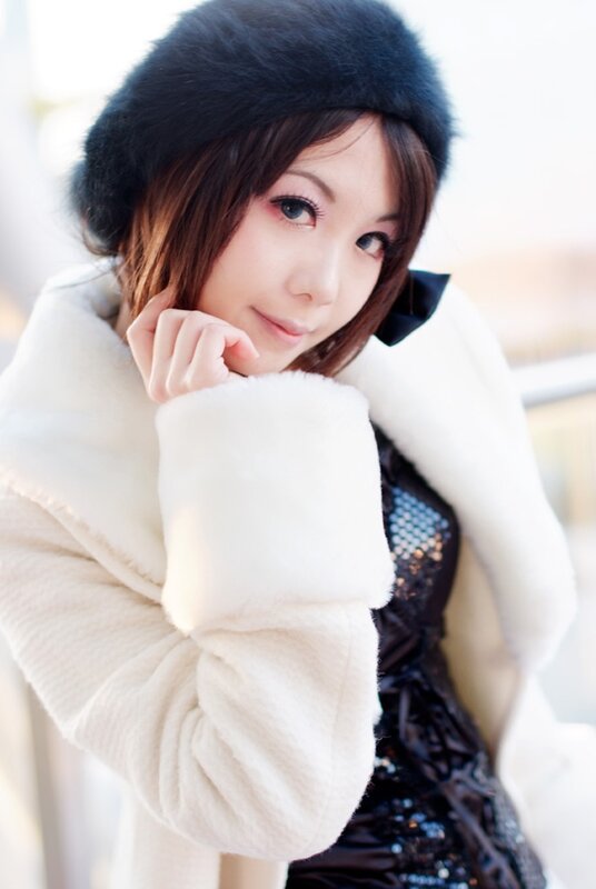 woman in white coat and hat