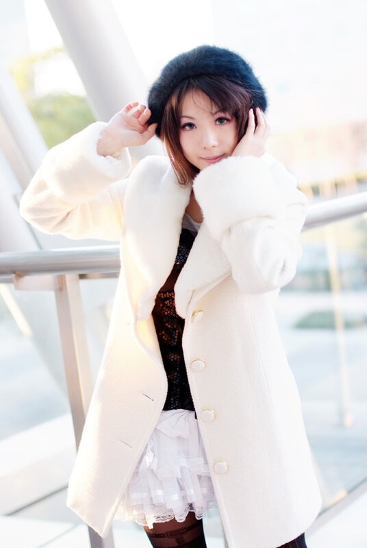 woman in white coat and hat