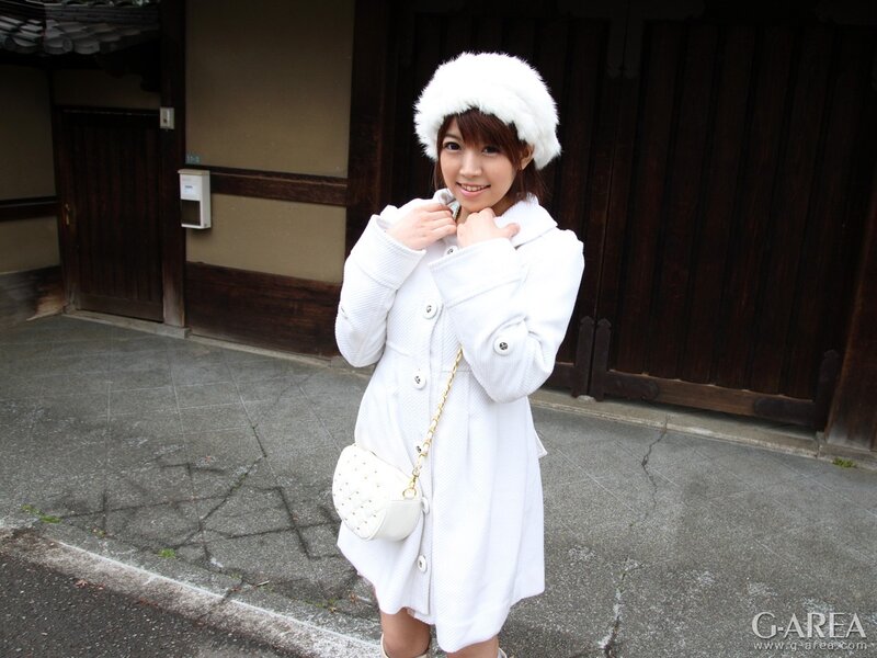 woman in white coat and hat