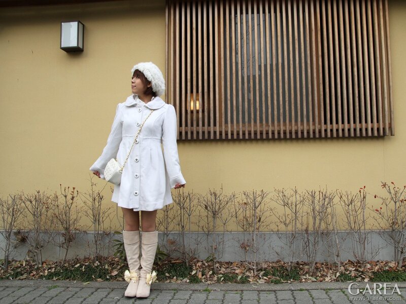 woman in white coat and hat