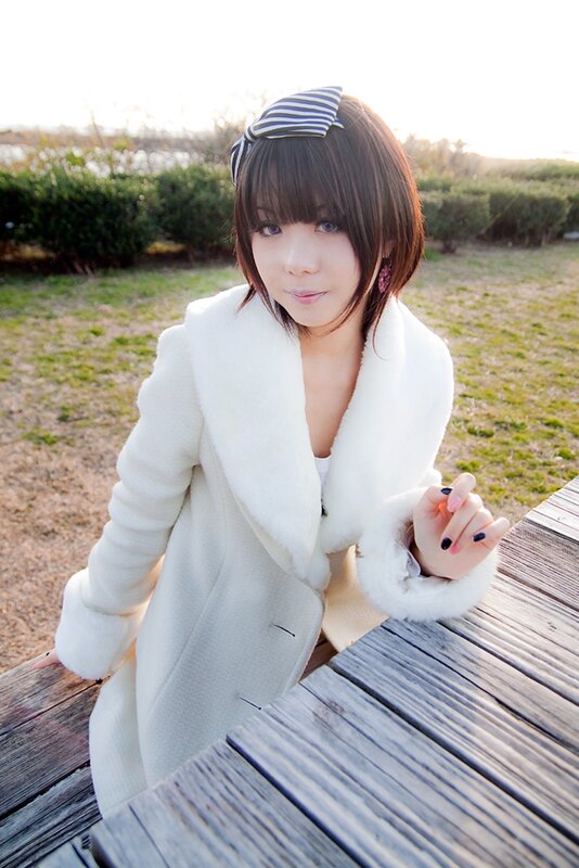 woman in white coat outdoors