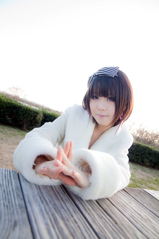 woman in white coat outdoors