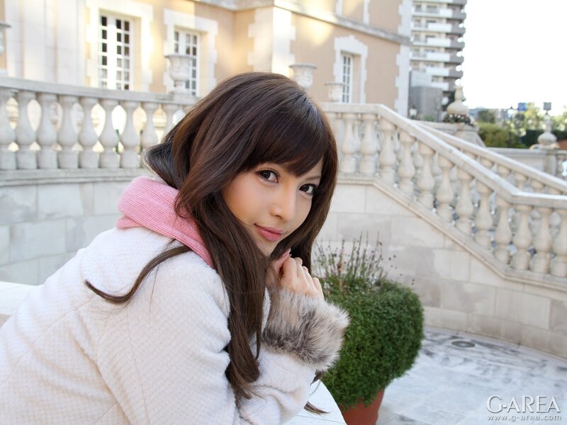 woman in white coat outdoors