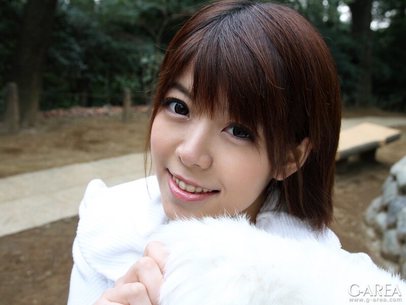 woman in white coat outdoors