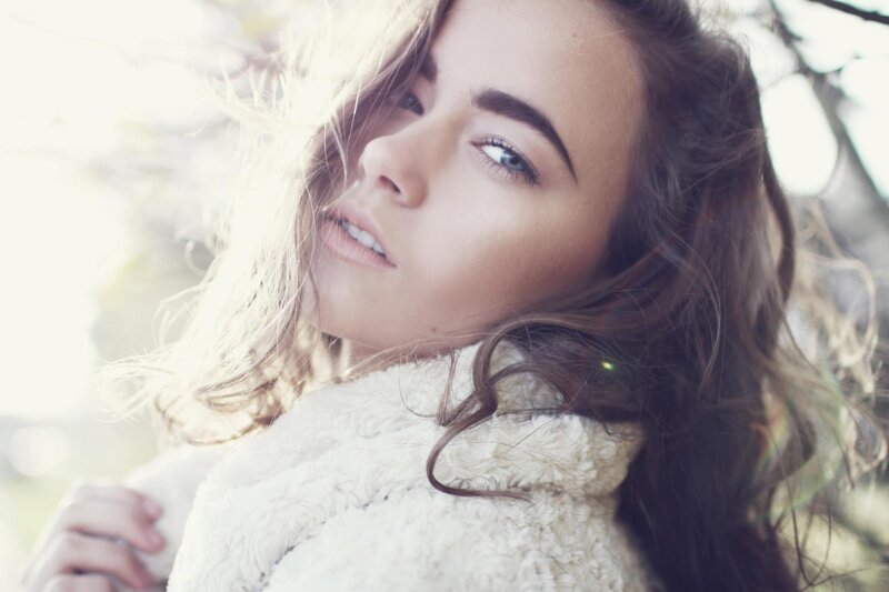 woman in white coat outdoors