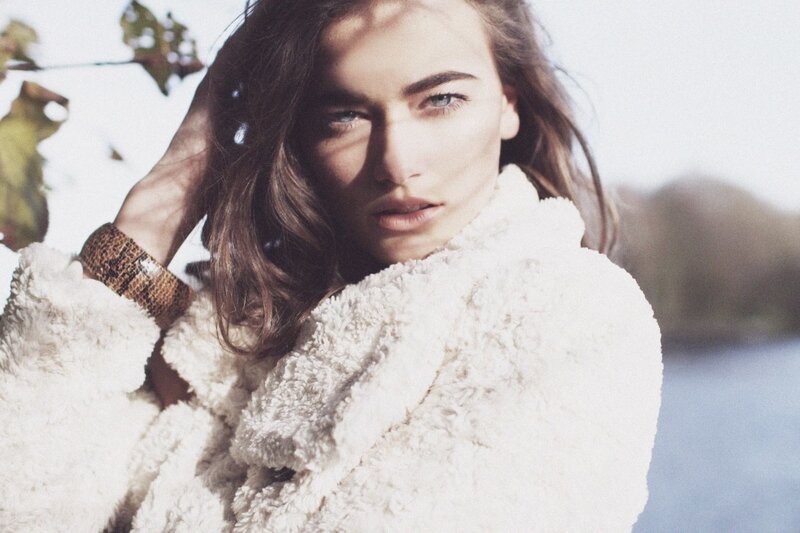 woman in white coat outdoors
