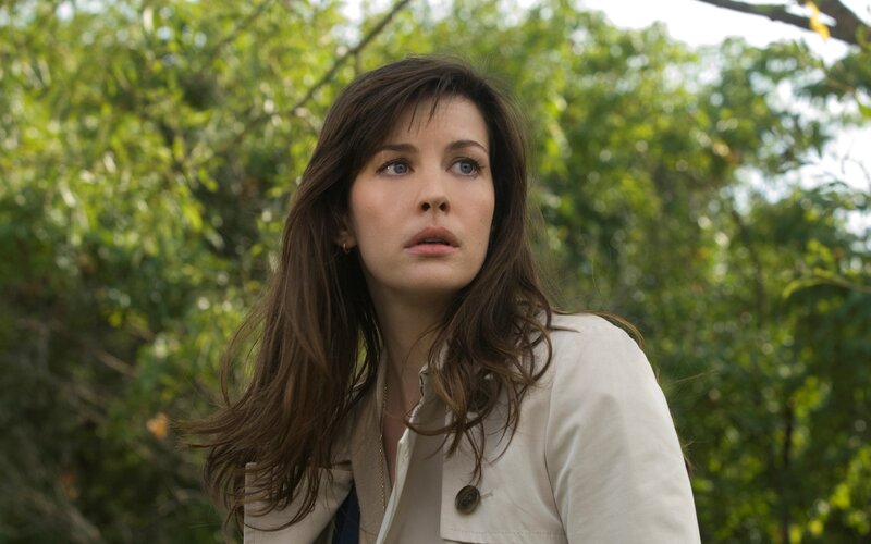 woman in white coat outdoors