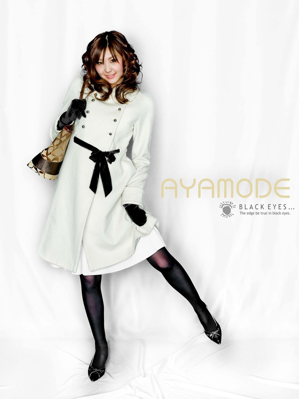 woman in white coat posing