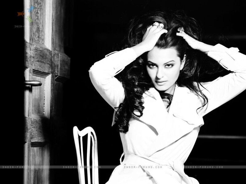 woman in white coat posing