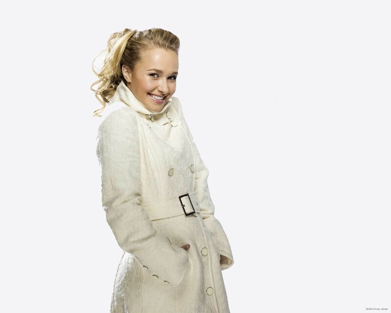 woman in white coat smiling