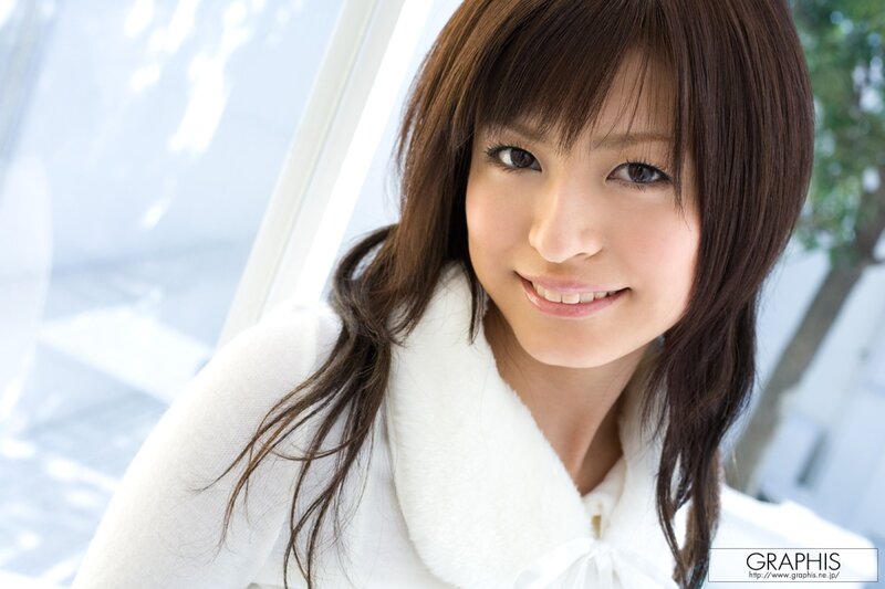 woman in white coat smiling