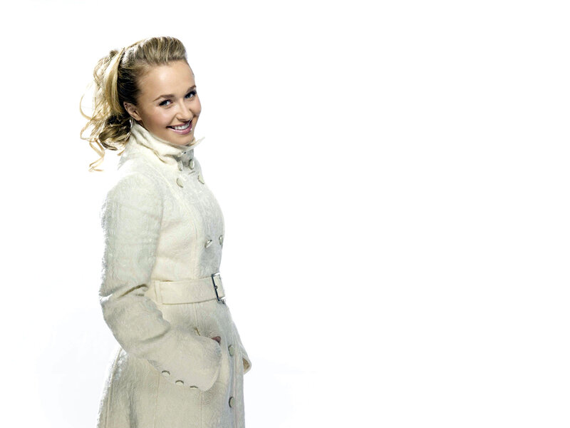 woman in white coat smiling