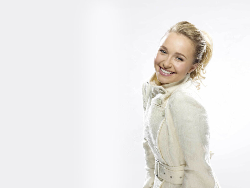 woman in white coat smiling