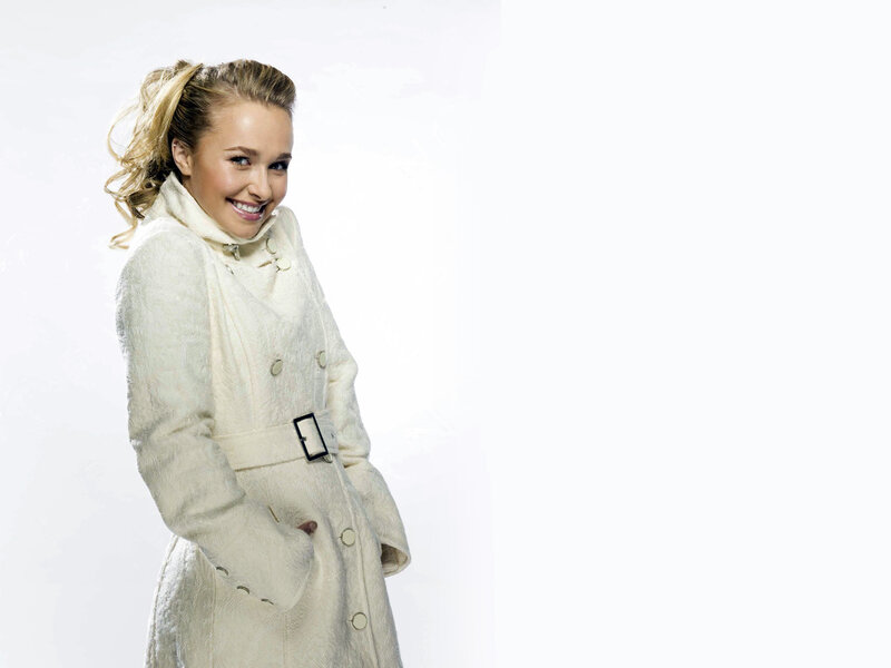 woman in white coat smiling