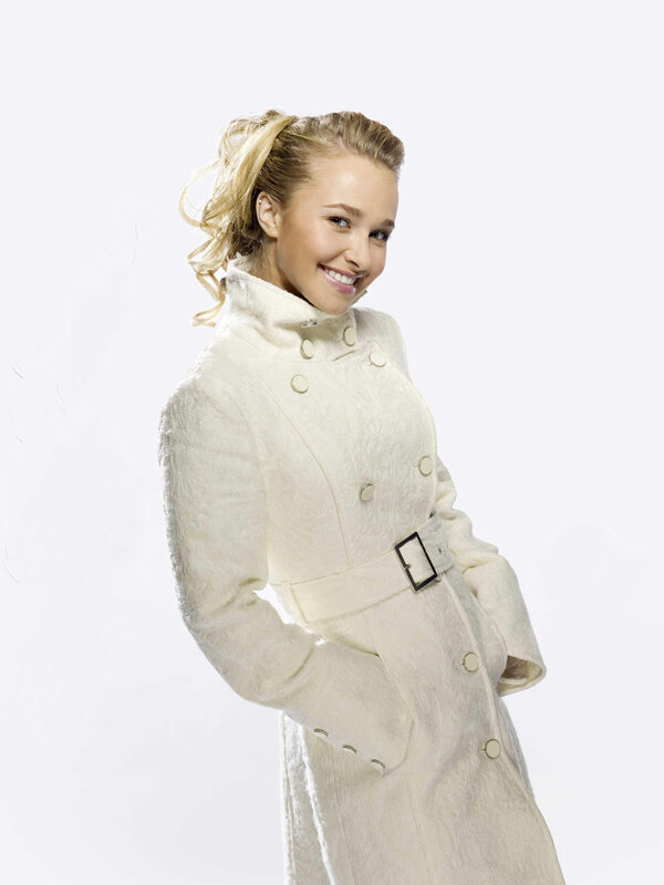 woman in white coat smiling