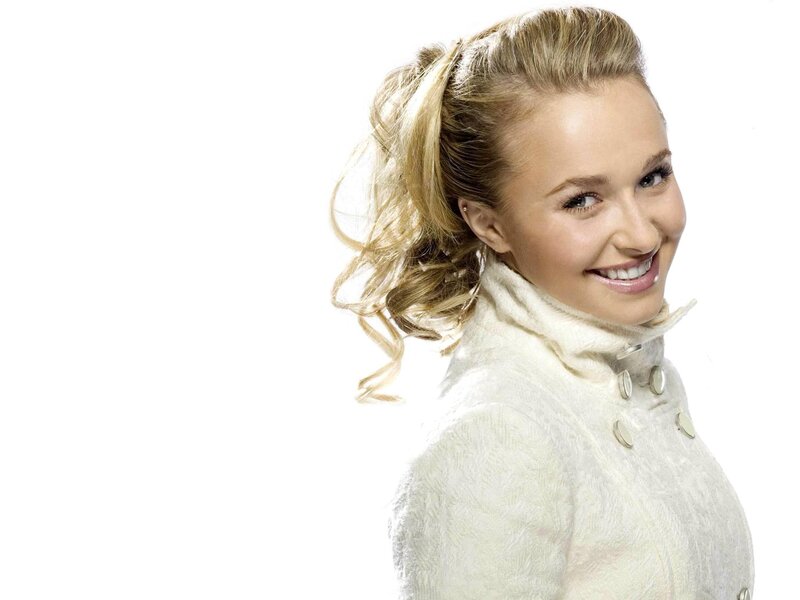 woman in white coat smiling