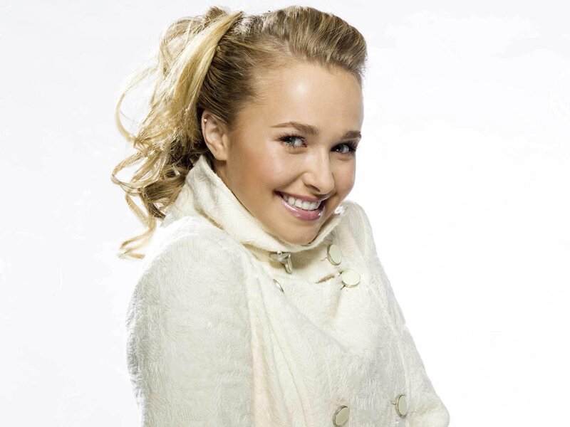 woman in white coat smiling