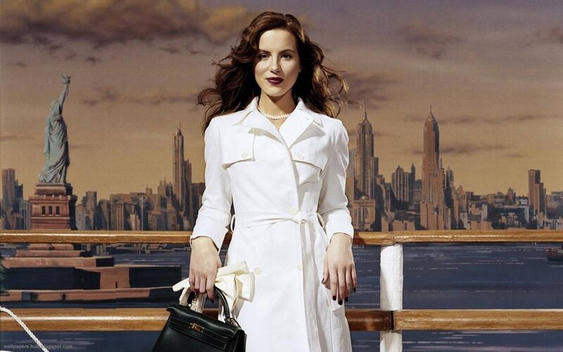 woman in white coat with city view
