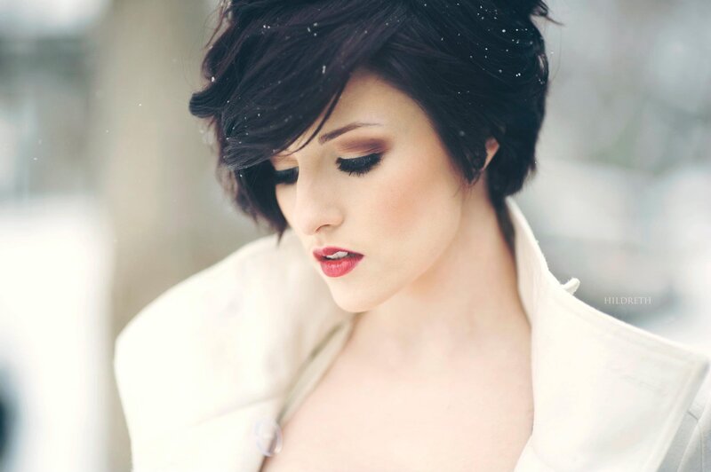 woman in white coat with snow
