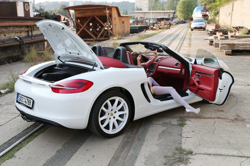 Woman in white convertible car