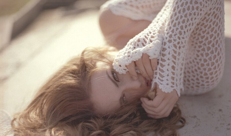 woman in white crocheted top
