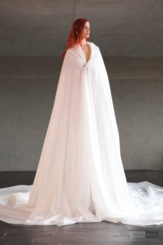 Woman in white draped gown
