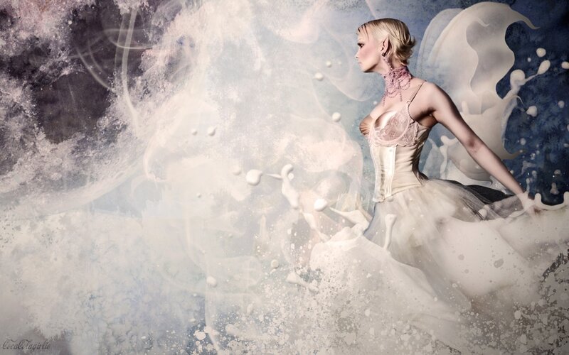 woman in white dress amidst splashes