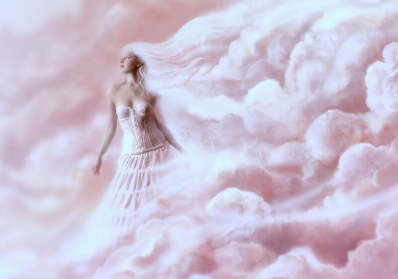 woman in white dress among clouds