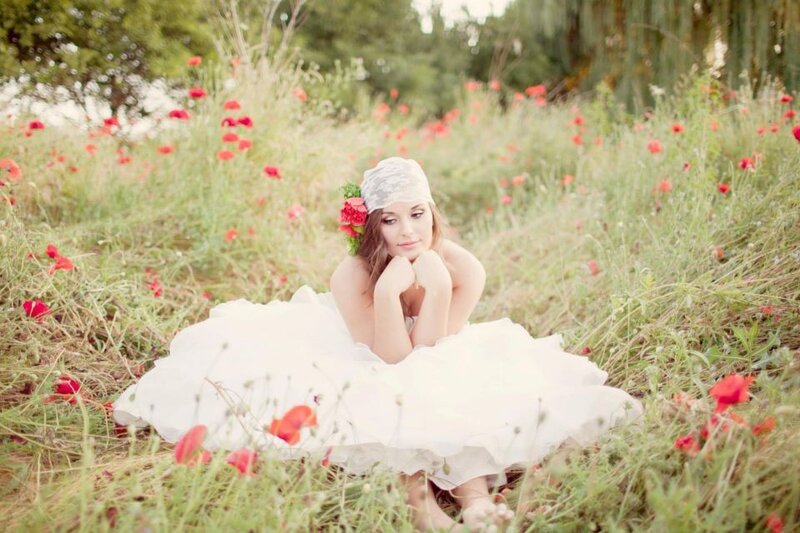 woman in white dress among poppies