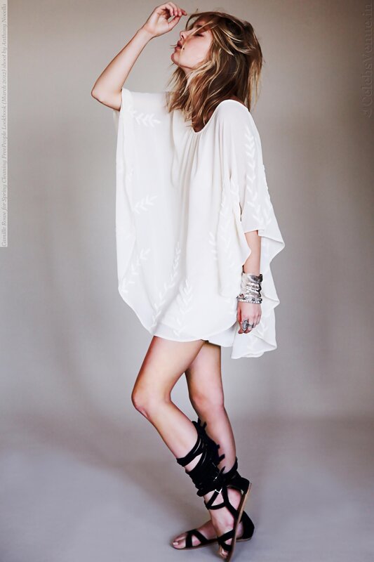 Woman in white dress and black sandals