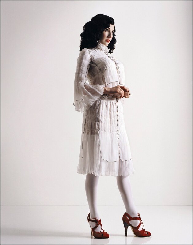 woman in white dress and red shoes