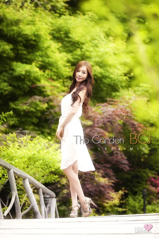 Woman in white dress at garden