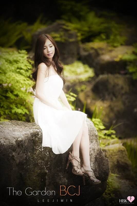 Woman in white dress at garden