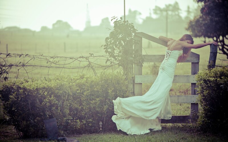 woman in white dress at gate