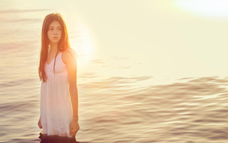woman in white dress at sunset