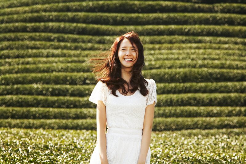 Woman in white dress at tea farm