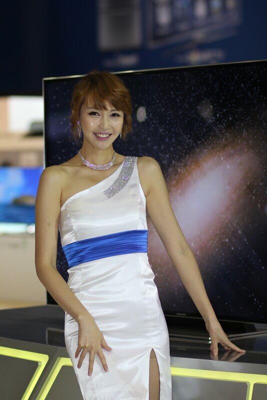 Woman in white dress at tech event