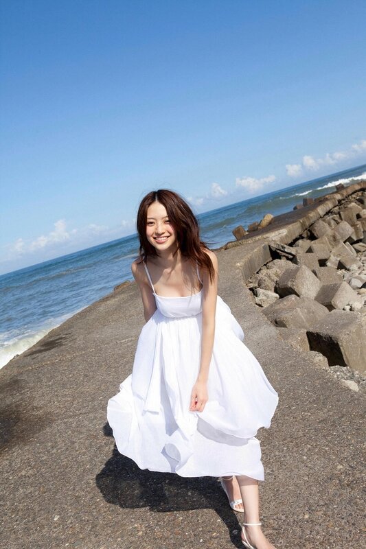 Woman in white dress at the beach