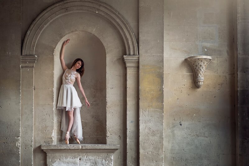 Woman in White Dress — Beige, Dramatic, Photograph, Archway