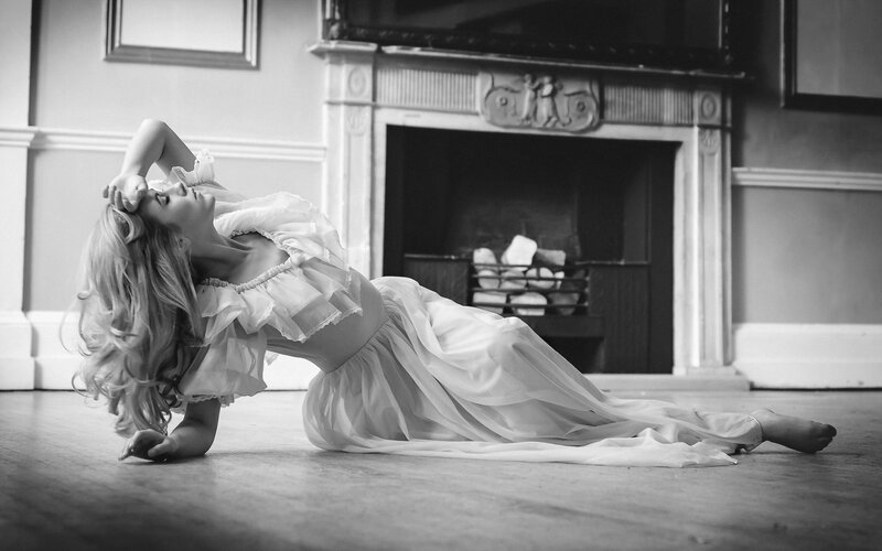 Woman in White Dress — Black, Dramatic, Photograph, Fireplace