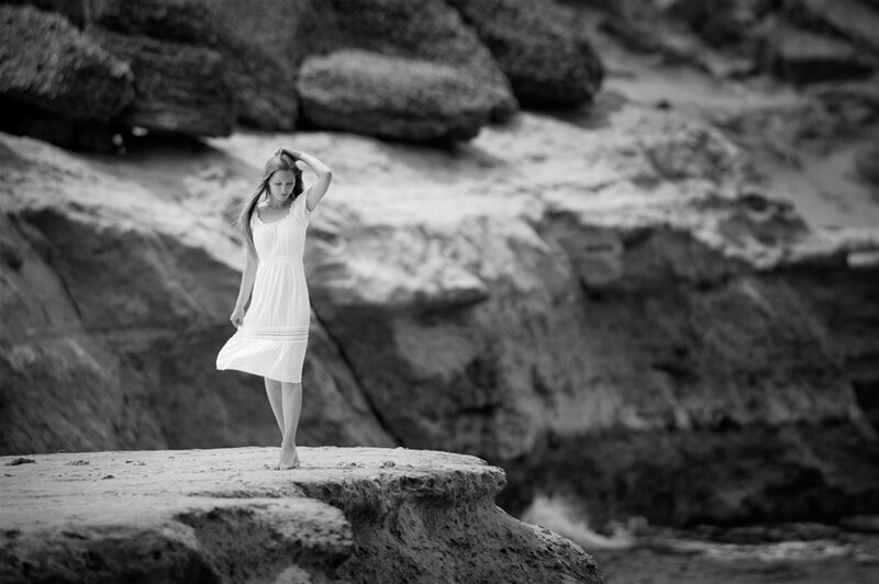 Woman in White Dress — Black, Serene, Photograph, Rocks