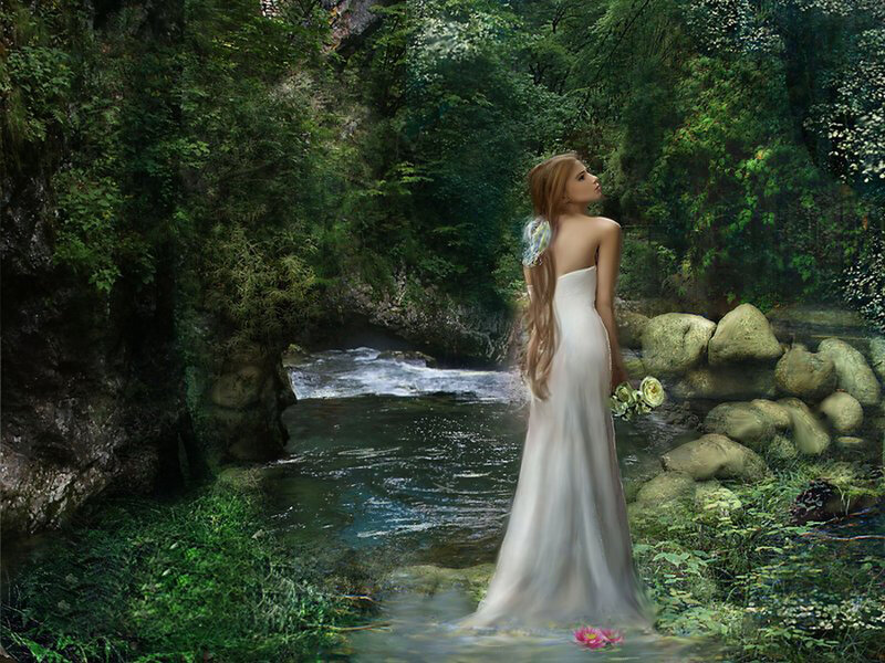 Woman in white dress by a stream