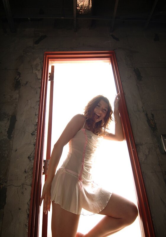 Woman in white dress by doorway