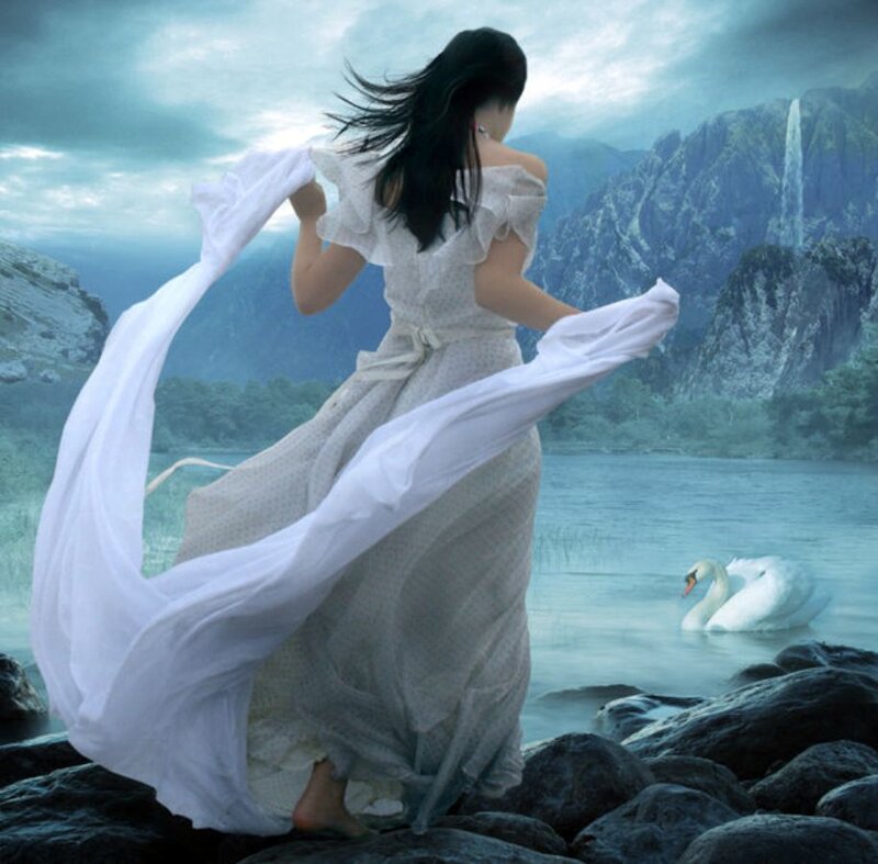 woman in white dress by lake
