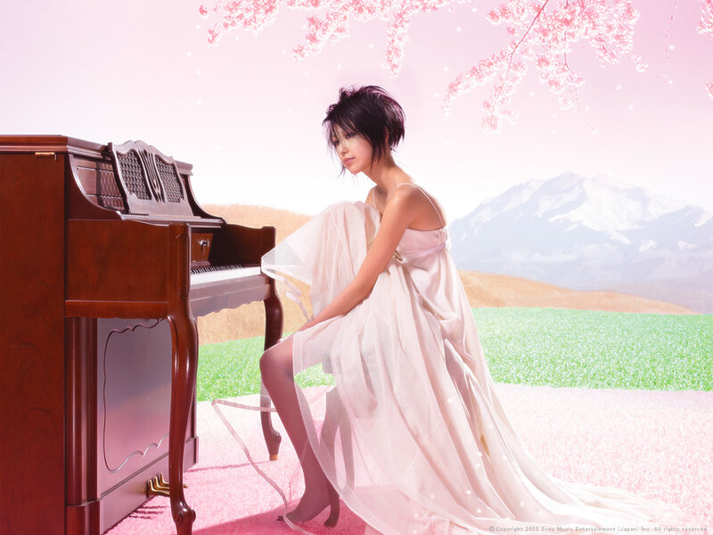 Woman in white dress by piano