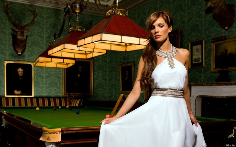 Woman in white dress by pool table