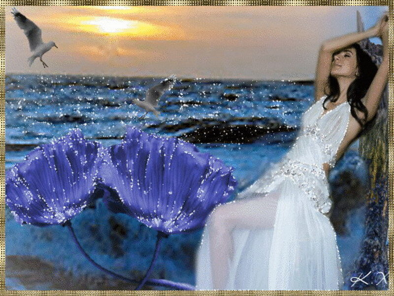 woman in white dress by the sea